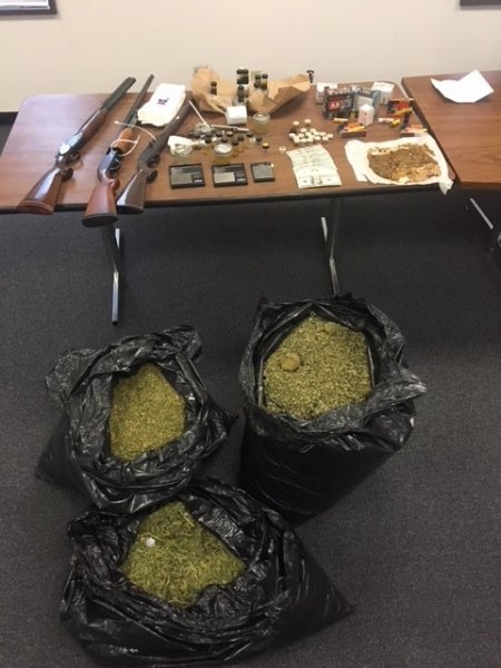 Also discovered were was over 50 pounds of marijuana, several firearms and ammunition during the search.